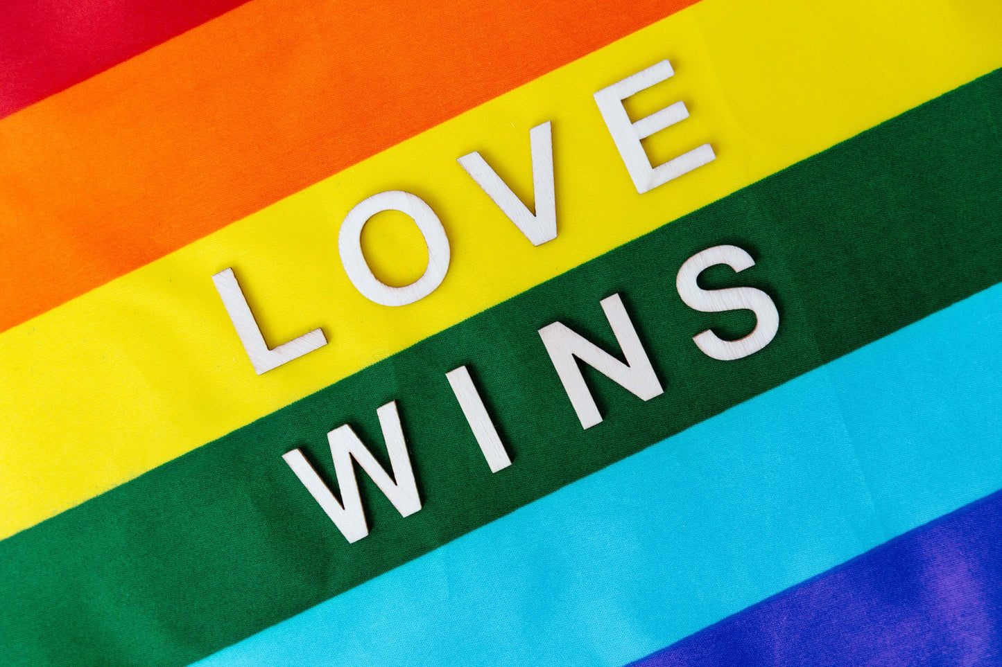 Rainbow flag with Love Wins written on it